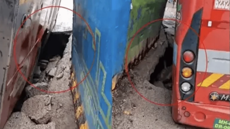 Mumbai Rains Update: BEST Bus Gets Stuck As Road Caves In Near Girgaon Metro Station Mumbai Rains Update: BEST Bus Gets Stuck As Road Caves In Near Girgaon Metro Station