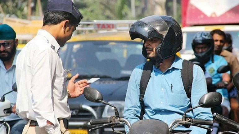 Man arrested for asking traffic police officer to wear a helmet