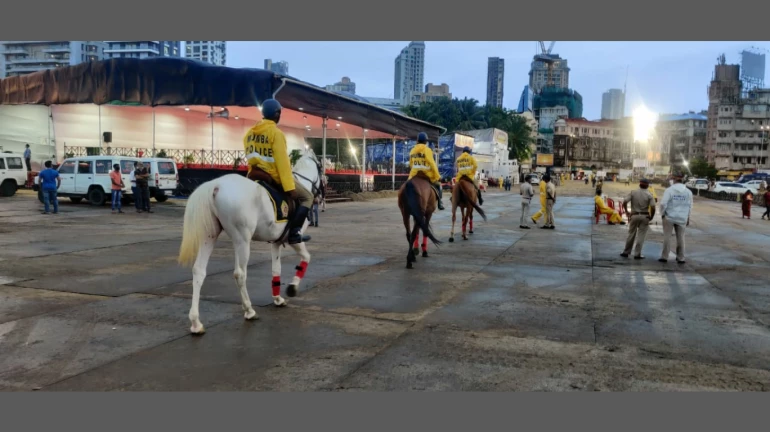 Mumbai Police use horses to patrol on Girgaum Chowpatty during Ganpati Visarjan Mumbai Police use horses to patrol on Girgaum Chowpatty during Ganpati Visarjan