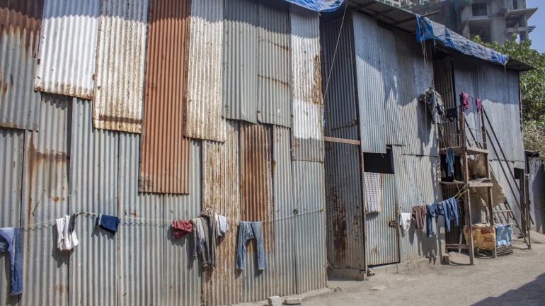 BMC hangs posters at bharatbhai chawl; states not responsible for any mishap BMC hangs posters at bharatbhai chawl; states not responsible for any mishap