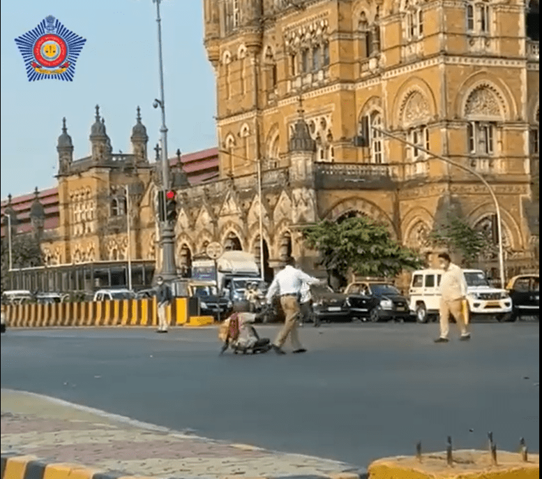 Mumbai Traffic Policeman lauded for helping differently-abled man cross busy road