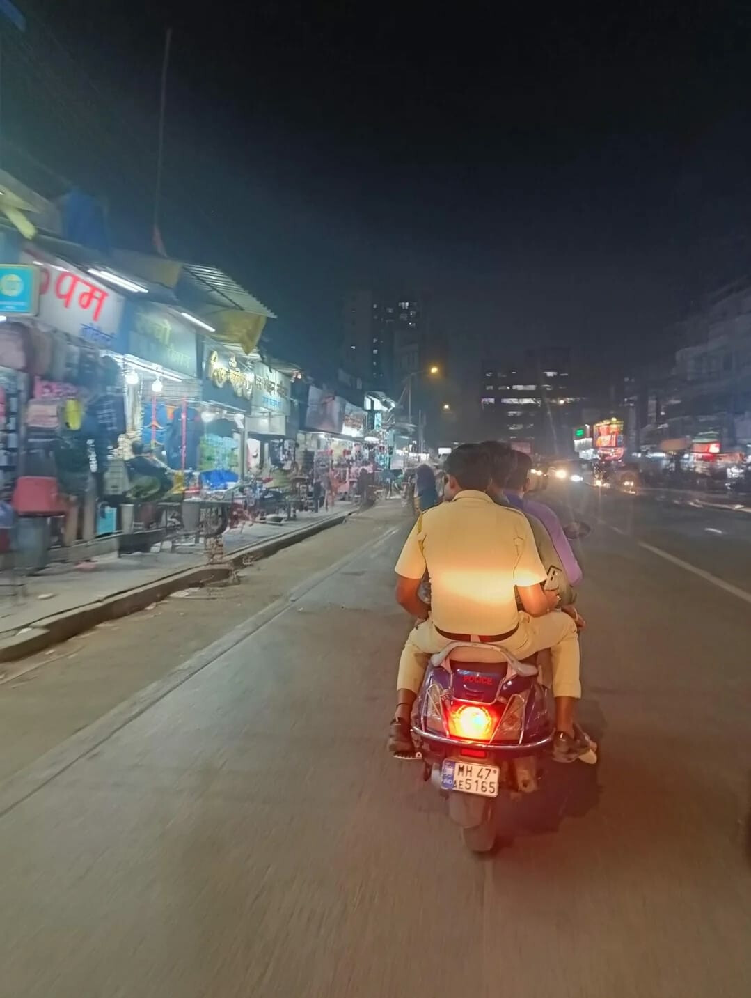Caught on Camera: Mumbai Cop Seen Riding Triple Seat on "Police" Scooter Without Helmet