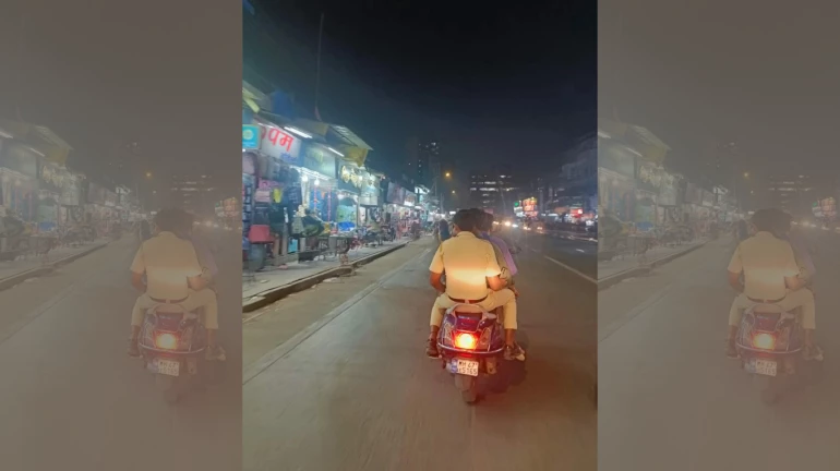 Caught on Camera: Mumbai Cop Seen Riding Triple Seat on "Police" Scooter Without Helmet Caught on Camera: Mumbai Cop Seen Riding Triple Seat on "Police" Scooter Without Helmet
