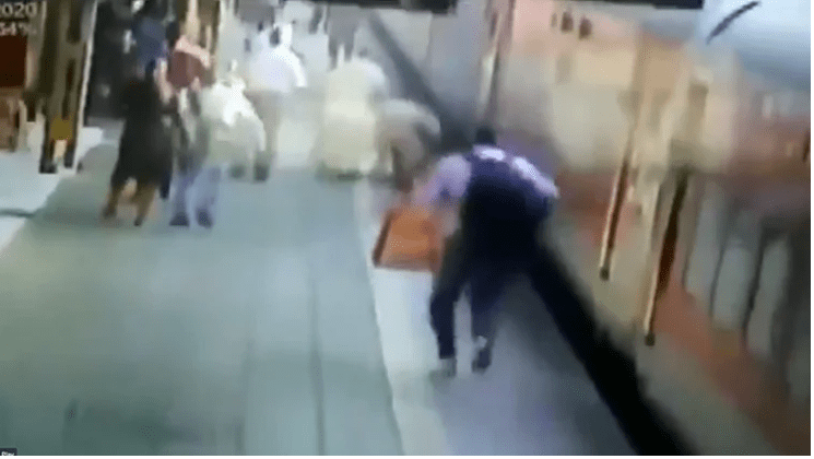 Woman tries to board a moving train, slips; RPF constable saves her