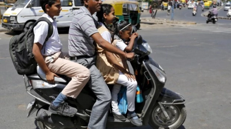 Govt proposes new guidelines for two-wheeler riders carrying kids