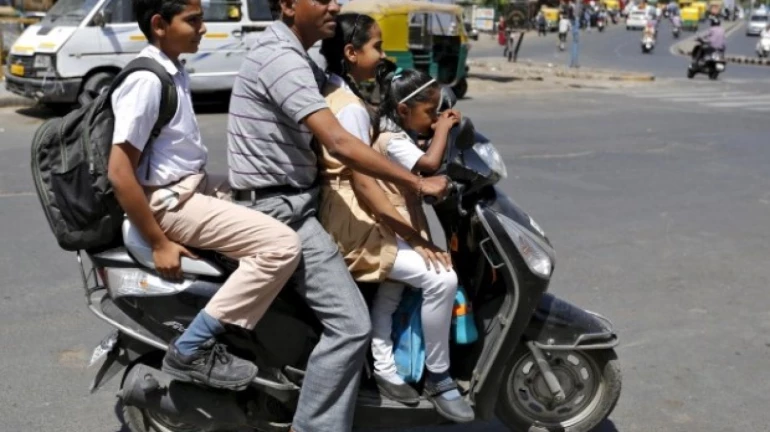 Govt proposes new guidelines for two-wheeler riders carrying kids Govt proposes new guidelines for two-wheeler riders carrying kids