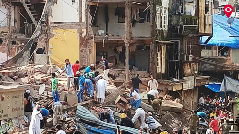 Who is responsible for the building collapse? MHADA or Burhani Trust?