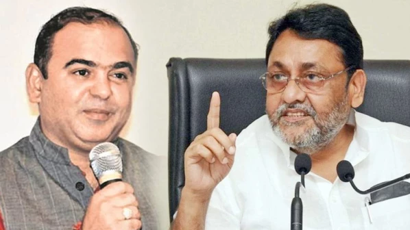 Malik accuses tourism minister Rawal of running a tainted company