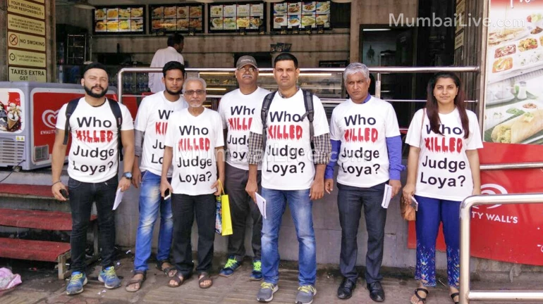 Who Killed Judge Loya? Activists protest in Mumbai’s local trains