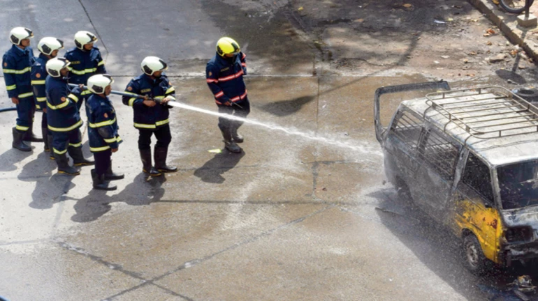 School van catches fire in Parel