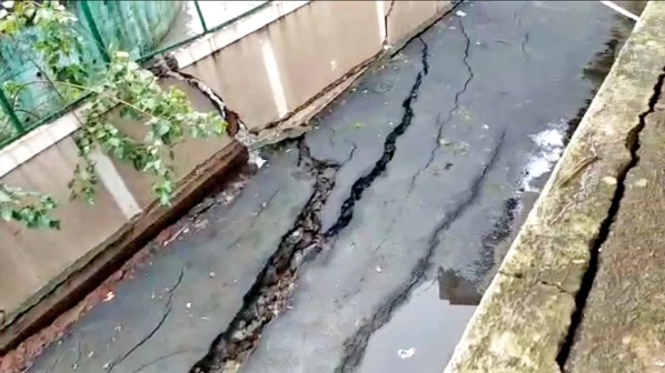 A boundary wall of Ghatkopar's Kalapataru Aura building and the adjacent road develops cracks